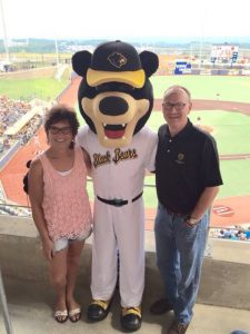 Peggy Lovio and David McCormick with Black Bears Mascot