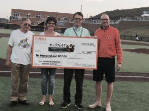 David and Peggy presenting MSNAP with the home run sponsor check at the Black Bears game.