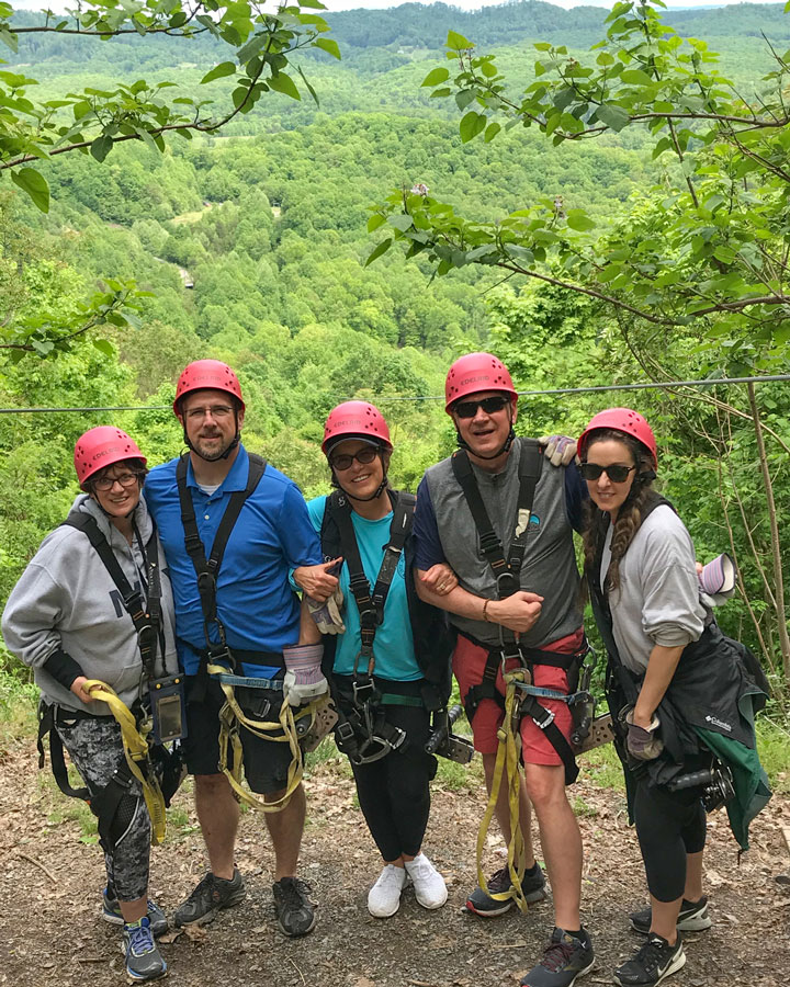 Dana, Leon, Peggy, David and Christina of Omega Commercial Interiors zip lining at the New River Gorge.